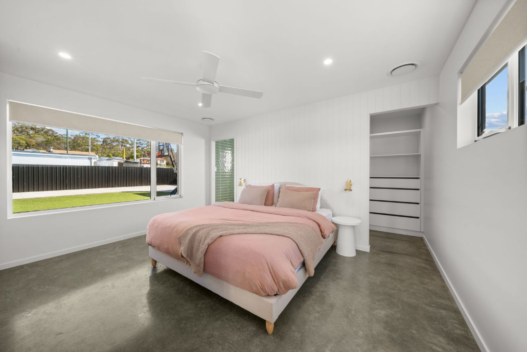 Blush bedroom with a garden outlook