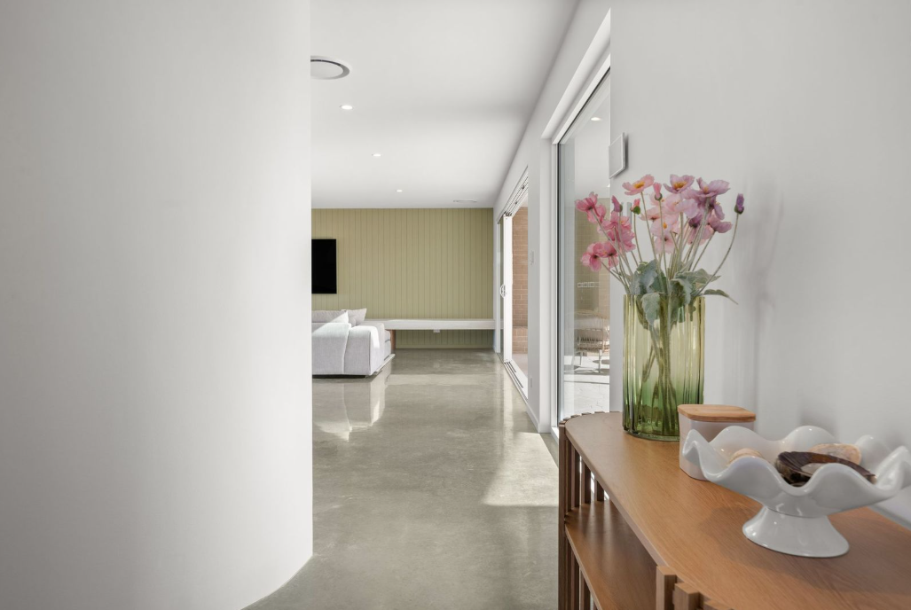 Light-filled hallway leading to the living room