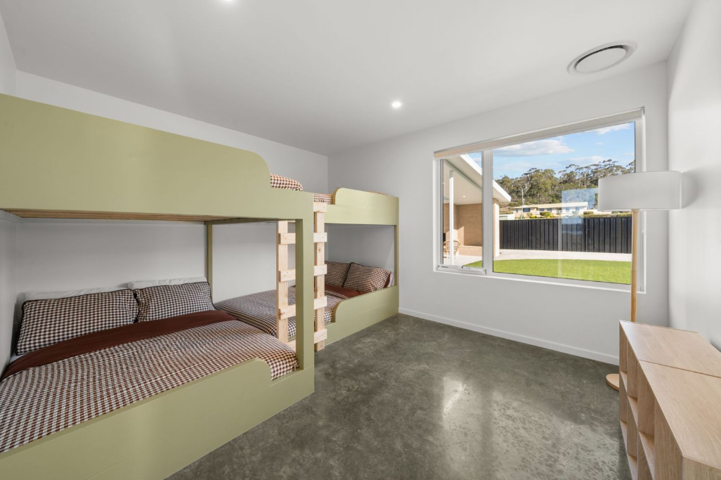 Sage bunk room with four beds